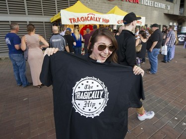 Tragically Hip fan Breeann Kindratsky shows off her new t-shirt before Sunday's concert at Rogers Arena.