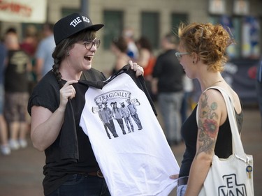 Fans check out t-shirts for sale before Sunday Night's Tragically Hip concert at Rogers Arena.