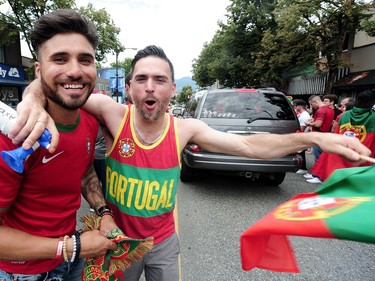 Jubilant Portuguese supporters celebrate on Vancouver's Commercial Drive after their team beat France to win the 2016 UEFA European Championship between Portugal and France, July 10, 2016.