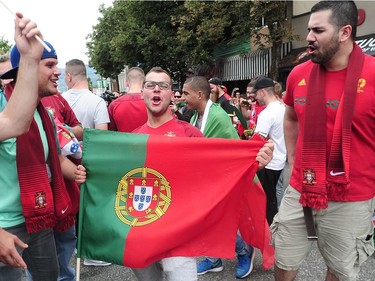 Jubilant Portuguese supporters celebrate on Vancouver's Commercial Drive after their team beat France to win the 2016 UEFA European Championship between Portugal and France, July 10, 2016.