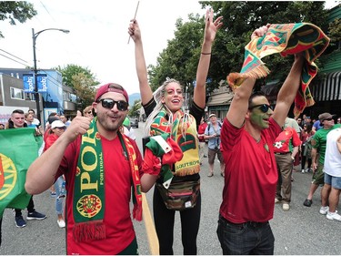 Jubilant Portuguese supporters celebrate on Vancouver's Commercial Drive after their team beat France to win the 2016 UEFA European Championship between Portugal and France, July 10, 2016.