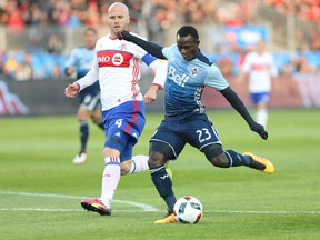 Vancouver Whitecaps forward Kekuta Manneh (23) takes a kick that beats Toronto FC goalkeeper Clint Irwin (1) for during the first half of MLS soccer in Toronto on Saturday, May 14, 2016.