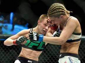 Womenís Strawweight fighter Rose Namajunas connects to the head of Paige VanZant, right, during a UFC Fight Night in Las Vegas on Thursday, Dec. 10, 2015.