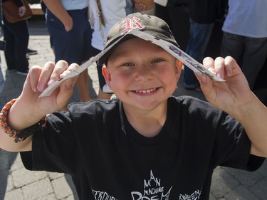 Aidan Robinson holds his tickets for the first concert of the Tragically Hip's final tour at the Save On Foods Memorial Centre in Victoria on Friday. It's the young man's first-ever concert.