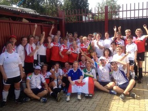 Kate Wolfe celebrates with her team at the 2013 World Masters Games held in Torino, Italy.