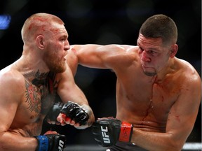 LAS VEGAS, NV - AUGUST 20:  Conor McGregor (L) and Nate Diaz battle during their welterweight rematch at the UFC 202 event at T-Mobile Arena on August 20, 2016 in Las Vegas, Nevada.  (Photo by Steve Marcus/Getty Images) ORG XMIT: 661875837