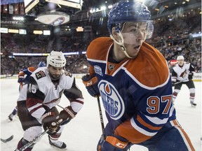 EDMONTON, AB. MARCH 11, 2016 - Connor McDavid of the Edmonton Oilers, looks to make a play before Boyd Gordonof the Arizona Coyotes arrives at Rexall Place in Edmonton.   Shaughn Butts / POSTMEDIA NEWS NETWORK