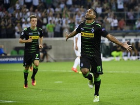 Gladbach&#039;s Raffael, right, celebrates scoring the second goal for his team during their Champions League Qualification playoff round second leg match between German Club Borussia Moenchengladbach and Swiss Club BSC Young Boys Bern, at the Borussia Park Stadium in Moenchengladbach, Germany, Wednesday, Aug. 24, 2016. (Manuel Lopez/Keystone via AP)