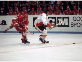 Phil Esposito of Team Canada skates with the puck as Vladimir Shadrin of the Soviet Union follows him during their 1972 Summit Series game at the Luzhniki Ice Palace in Moscow, Soviet Union in September, 1972.