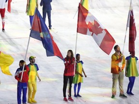 Canadian-swimmer-Penny-Oleksiak-bears-the-Canadian-flag-at-the-closing-ceremony-of-Rio-Olympics