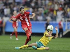 Canada's Christine Sinclair, left, scores her team's 2nd goal, during the 2016 Summer Olympics football match between Canada and Australia, at the Arena Corinthians, in Sao Paulo, Brazil, Wednesday, Aug. 3, 2016. Fresh from a roller-coaster 2-0 win over Australia, the Canadian women's soccer team turns its attention to Saturdays game against 93rd-ranked Zimbabwe.