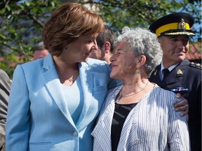 Christy Clark, left, embraces Leslie McBain, whose son died of an opioid overdose in 2014. McBain says she's glad the premier recognizes there's a problem, but that little is being done about it.