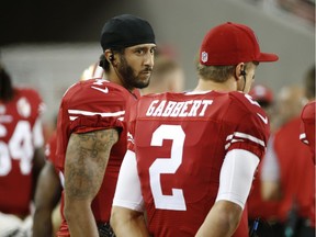 San Francisco 49ers quarterbacks Colin Kaepernick, left, and Blaine Gabbert stand on the sideline during the second half of an NFL preseason football game against the Green Bay Packers on Friday, Aug. 26, 2016, in Santa Clara, Calif. Green Bay won 21-10.