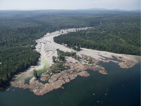 Contents from a tailings pond is pictured going down the Hazeltine Creek into Quesnel Lake near the town of Likely, B.C. on August, 5, 2014. Amnesty International Canada is calling on the province to fully clean up the Mount Polley site and fix B.C.’s mining regulation, compliance and enforcement mechanisms.