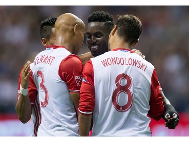 San Jose Earthquakes' Simon Dawkins, back centre, celebrates his goal against the Vancouver Whitecaps with teammates Darwin Ceren, back left, Jordan Stewart and Chris Wondolowski during the second half of an MLS soccer game in Vancouver, B.C., on Friday August 12, 2016.