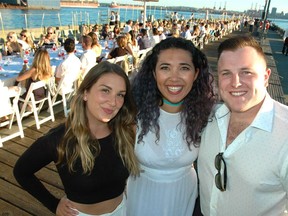 From left, community builders Alex Troll, Adriana Koc-Spadaro and Justin Duggan fronted North Vancouver's second Dinner on the Pier, which drew 300 guests to the al fresco dinner in support of Growing Chefs. [PNG Merlin Archive]