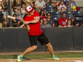 Brendan Gallagher swings away during his slopitch charity game at Nat Bailey Stadium last year.