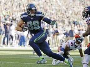Seattle Seahawks tight end Jimmy Graham runs for a touchdown after a reception against the Chicago Bears in the second half of an NFL football game, Sunday, Sept. 27, 2015, in Seattle.