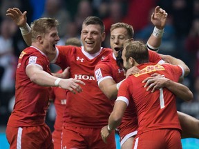 Canada's John Moonlight, from left to right, Adam Zaruba, Harry Jones, Nathan Hirayama and Sean White celebrate after Hirayama kicked a conversion to defeat France during World Rugby Sevens Series' Canada Sevens Bowl final action, in Vancouver, B.C., on Sunday March 13, 2016.