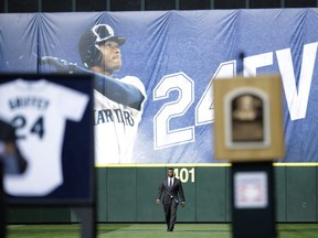 Seattle Mariners Hall-of-Famer Ken Griffey Jr. walks in from center field after being introduced during a ceremony to retire his number 24, Saturday, Aug. 6, 2016, at Safeco Field in Seattle.