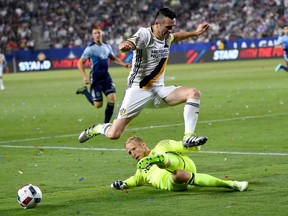 The L.A. Galaxy are loaded with high-flying stars — Robbie Keane leaping over Vancouver goalie David Ousted here, for example — and will be a handful for the underdog Whitecaps on Saturday night in California.