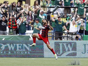 Diego Valeri celebrates his goal to help the Timbers defeat Sporting Kansas City 3-0 Sunday in Portland, Ore. The Timbers passed the Whitecaps into sixth place (the final playoff position) in the MLS Western Conference. The Caps have 10 games left.