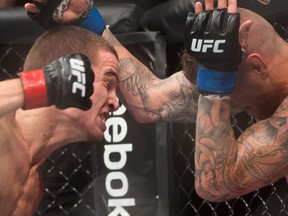 Jeremy Kennedy, left, of Surrey, B.C., and Alessandro Ricci, of Woodbridge, Ont., fight during a lightweight bout during a UFC Fight Night event in Vancouver.