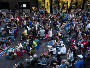 People gather during a viewing party for the final stop in Kingston, Ont., of a 10-city national concert tour by The Tragically Hip, in Vancouver, B.C., on Saturday August 20, 2016. Lead singer Gord Downie announced earlier this year that he was diagnosed with an incurable form of brain cancer. THE CANADIAN PRESS/Darryl Dyck ORG XMIT: VCRD112