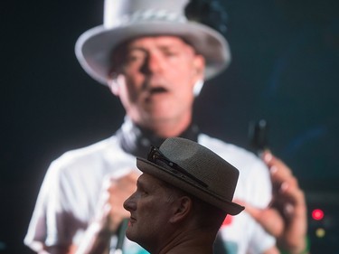 Lead singer Gord Downie is seen performing on a screen as a man watches during a viewing party for the final stop in Kingston, Ont., of a 10-city national concert tour by The Tragically Hip, in Vancouver, B.C., on Saturday August 20, 2016. Downie announced earlier this year that he was diagnosed with an incurable form of brain cancer. THE CANADIAN PRESS/Darryl Dyck ORG XMIT: VCRD107