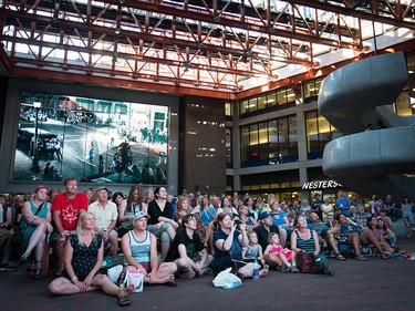 People gather for a viewing party for the final stop in Kingston, Ont., of a 10-city national concert tour by The Tragically Hip, in Vancouver, B.C., on Saturday August 20, 2016. Lead singer Gord Downie announced earlier this year that he was diagnosed with an incurable form of brain cancer. THE CANADIAN PRESS/Darryl Dyck ORG XMIT: VCRD102