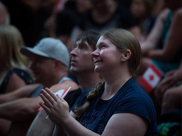 Tears run down a woman's face during a viewing party for the final stop in Kingston, Ont., of a 10-city national concert tour by The Tragically Hip, in Vancouver, B.C., on Saturday August 20, 2016. Lead singer Gord Downie announced earlier this year that he was diagnosed with an incurable form of brain cancer. THE CANADIAN PRESS/Darryl Dyck ORG XMIT: VCRD122