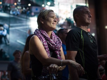 A woman and man listen during a viewing party for the final stop in Kingston, Ont., of a 10-city national concert tour by The Tragically Hip, in Vancouver, B.C., on Saturday August 20, 2016. Lead singer Gord Downie announced earlier this year that he was diagnosed with an incurable form of brain cancer. THE CANADIAN PRESS/Darryl Dyck ORG XMIT: VCRD114