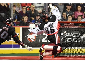 Christian Del Bianco tries for an acrobatic save in an NLL pre-season game with the Calgary Roughnecks against Rhys Duch and the Vancouver Stealth. The 18-year-old goalie carries the 25-0 Coquitlam Adanacs into the B.C. Junior A Lacrosse League final series. Candice Ward photo files