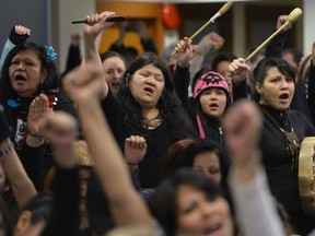 People react as Commissioner Wally Oppal delivers the final report of the Missing Women Inquiry in Vancouver, Monday, Dec.17, 2012.