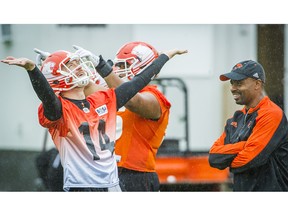 B.C. Lions offensive coordinator and quarterbacks coach Khari Jones, right, and quarterback Travis Lulay, left, during the team's practice at their facility in Surrey, B.C. Tuesday August 2, 2016. (Ric Ernst / PNG)