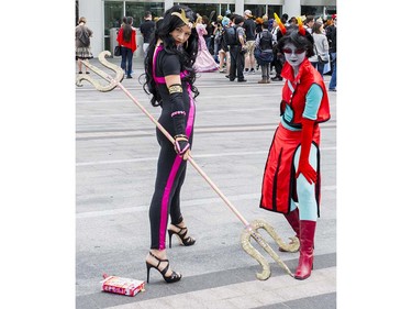 Annette Bakala as Her Imperious Condescension, left and Jules Bakala as Neophyte Redglare, right pose at Anime Revolution, a three-day convention of  activities, exhibits, panels and performances of the popular Japanese-born anime art form in Vancouver Sunday August 7, 2016.