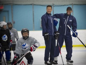 Richmond  B.C. August 16, 2016  Helping  the kids--  N.H.L. players Kevin Bieksa and Jason Garrison, (r) two former Canucks defencemen have some fun with kids as they assist in hockey school program in Richmond, where they also train the upcoming N.H.L. season.    Mark van Manen/ PNG Staff photographer   see Steve Ewen  Province /Vancouver Sun/   sports /stories  and Web.  00044451A [PNG Merlin Archive]