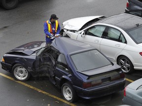 RICHMOND, BC., November 29, 2011 -- Workers at the ICBC damaged vehicle  lot at the south end of the Queensborough Bridge in Richmond, BC., November 29, 2011. ICBC is applying to raise rates by an average of $30 per year.  (Nick Procaylo/PNG) [PNG Merlin Archive]