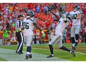 Running back Troymaine Pope #26 of the Seattle Seahawks reacts after scoring the game winning two point conversion against the Kansas City Chiefs during the second half on August 13, 2016 at Arrowhead Stadium in Kansas City, Missouri.