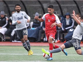 Simon Fraser Clan senior Ryan Dhillon (centre) has returned to the team after missing all of 2015 with a knee injury. (Ron Hole, SFU athletics) [PNG Merlin Archive]