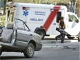 An ambulance attends a car accident on Burrard near Dunsmuir streets. Doesn't matter the time of day, the traffic or the weather, when drivers hear a siren they react most often in a manner that is uniform and kind: They get out of the way, writes columnist Wayne Moriarty. — Bill Keay files