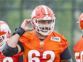 B.C. Lions centre Cody Husband has his eyes on the camera during the CFL team’s practice in Surrey on Tuesday.