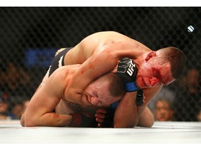 LAS VEGAS, NV - MARCH 5:  Nate Diaz applies a choke hold to win by submission against Conor McGregor during UFC 196 at the MGM Grand Garden Arena on March 5, 2016 in Las Vegas, Nevada.