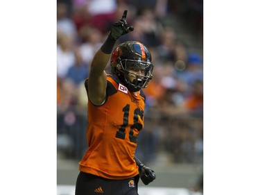BC Lions #16 Bryan Burnham gestures after scoring a touchdown against the Hamilton Tiger-Cats.