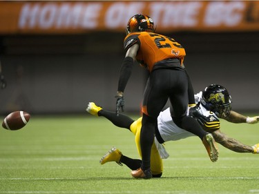 BC Lions #29 Steven Clarke covers Hamilton Tiger-Cats  #2 Chad Owens.