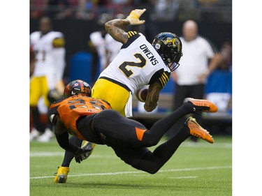 BC Lions #29 Steven Clarke tackles Hamilton Tiger-cats #2 Chad Owens.