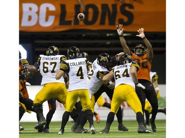 Hamilton Tiger-Cats  #4 Zach Collaros passes to tie the game against the BC Lions.