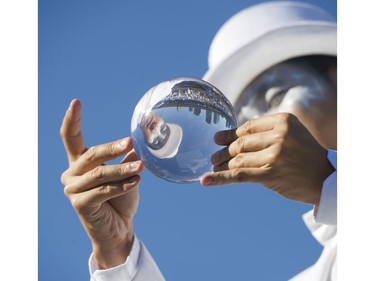 A juggler greets those attending Le Diner en Blanc at Concord Pacific Place Vancouver, August 18 2016.