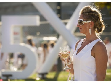 A woman at Le Diner en Blanc at Concord Pacific Place Vancouver, August 18 2016. ( Gerry Kahrmann  /  PNG staff photo)  ( Prov / Sun News ) 00044608A  [PNG Merlin Archive]