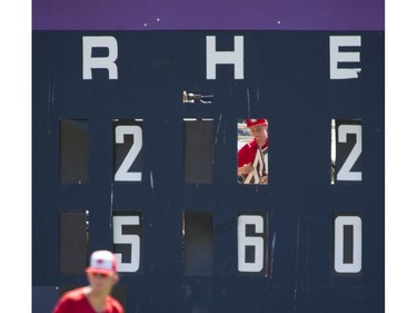 VANCOUVER August 19 2016. Henry Bull changes  the numbers for hits on the scoreboard for a Vancouver Canadians game at Nat Bailey stadium  Vancouver, August 19 2016. ( Gerry Kahrmann  /  PNG staff photo)  ( Prov / Sun News ) 00044657A Story by Steve \Ewen [PNG Merlin Archive]